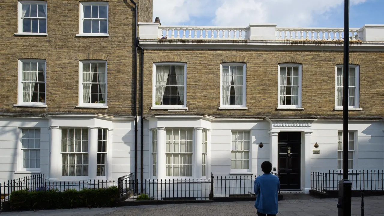 Painted timber sash windows on the front of a traditional period home